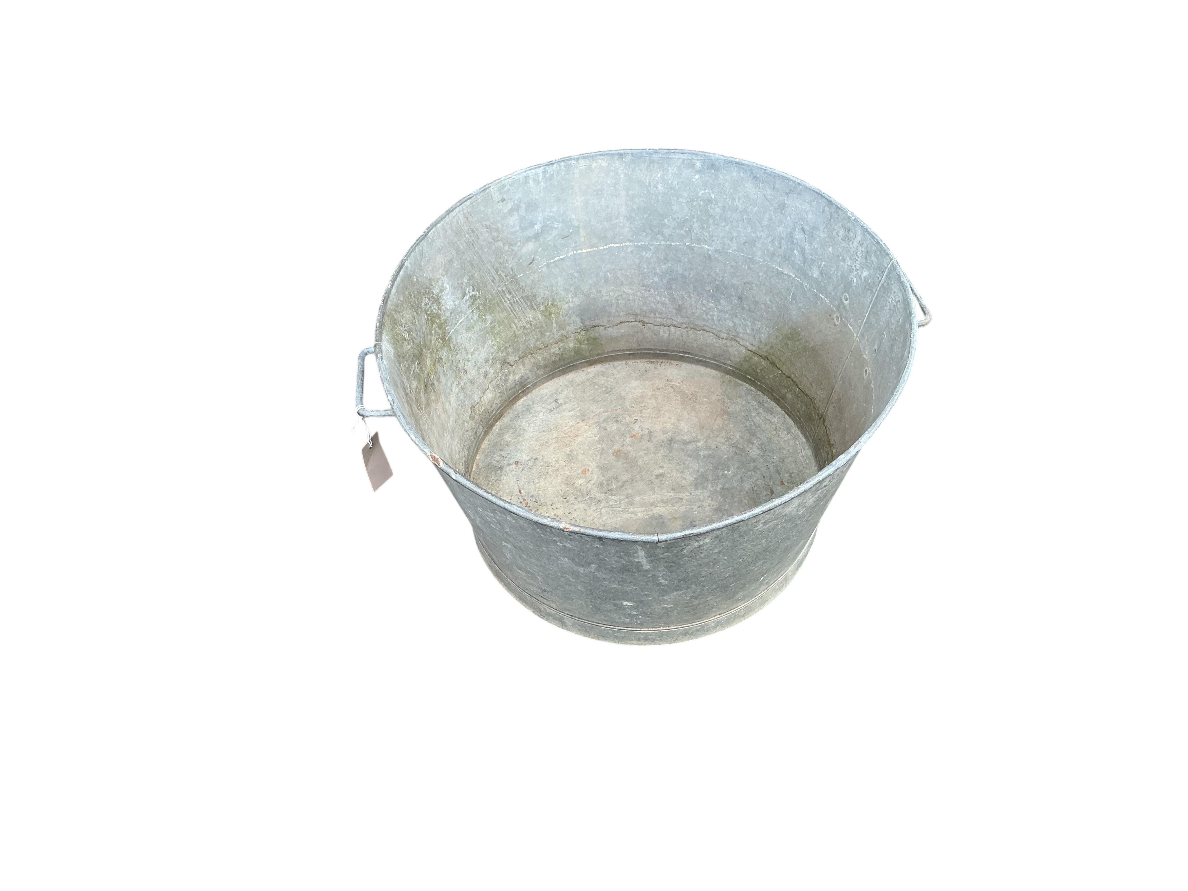 A vintage circular galvanised container, diameter 60cm, height 36cm